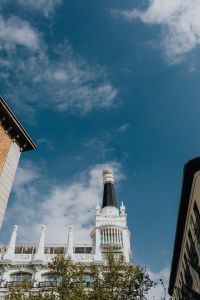Kaboompics - Vertical Madrid Rooftop Tower and Expansive Blue Sky Between Buildings