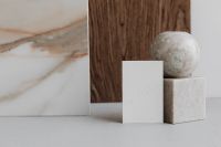Kaboompics - Stone Sphere and Pedestal with Blank Card beside Marble Slab, Neutral Product Mockup