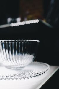 Kaboompics - Ribbed Crystal Bowl and Plate with Soft Bokeh