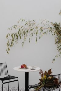 Kaboompics - Outdoor Cafe Table with Croissant, Espresso and Autumn Bouquet