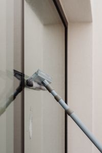 Kaboompics - Squeegee on a Glass Window During Home Cleaning