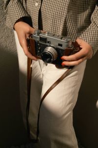 Kaboompics - Holding A Classic Analog Camera In Natural Light