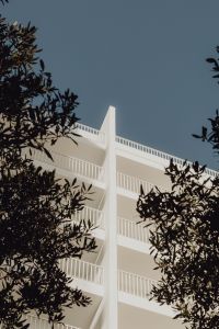 Kaboompics - White Minimalist Building with Metal Railings