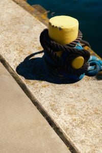 Kaboompics - Yellow Harbor Bollard With Mooring Rope on Pier