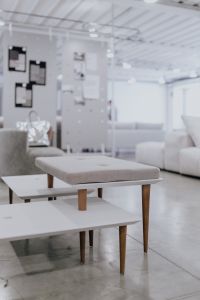 Kaboompics - White Nested Coffee Tables and Upholstered Bench in a Bright Showroom