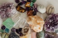 Kaboompics - Assorted Tumbled Gemstones with Amethyst Clusters and Clear Quartz on White