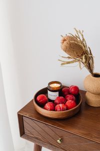 Kaboompics - Candle in a jar - plums - furniture