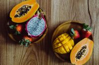 Kaboompics - Overhead Tropical Fruit Flat Lay with Papaya, Dragon Fruit, Mango and Strawberries for Healthy Recipe Content
