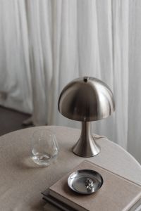 Kaboompics - Chrome Dome Lamp, Glass and Metal Bowl on Neutral Table