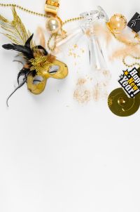 Kaboompics - New Year's Eve Party Background With Gold Mask and Decorations