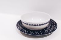 Kaboompics - White Ceramic Bowl on Blue Patterned Plate