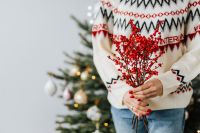 Kaboompics - Woman Holding Winter Berry Arrangement