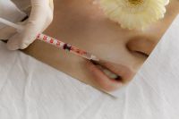 Kaboompics - Cosmetic Injection Syringe Near Woman’s Lips