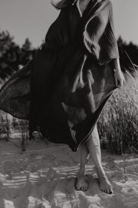 Kaboompics - Black and White Barefoot Woman in Flowing Kaftan Dress