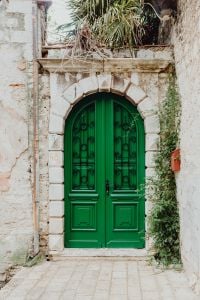 Kaboompics - Green Arched Door in a Weathered Stone Wall, Rovinj