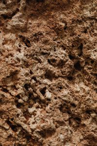 Kaboompics - Warm Brown Rock Background with Shadowed Natural Pockets