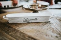 Kaboompics - White Ceramic Baguette Serving Dish on Rustic Wood Table, Kitchen Tableware