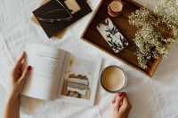 Kaboompics - Woman read book and drink coffee