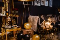 Kaboompics - New Year's Eve Living Room Party with Lit Sparkler, Balloons and Champagne Glasses
