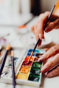Kaboompics - A woman paints with watercolors