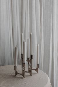 Kaboompics - Chrome Candelabra on Neutral Fabric-Covered Table