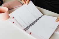 Kaboompics - Open Planner and Pink Mug on a Bright Home Office Desk