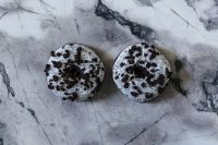 Kaboompics - Two Cookies And Cream Donuts On White Marble