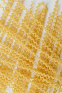 Kaboompics - Loose Fusilli Lunghi Bucati Strands on White, Vertical Recipe Background