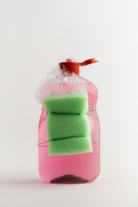 Kaboompics - Pink Cleaning Bottle With Green Sponges