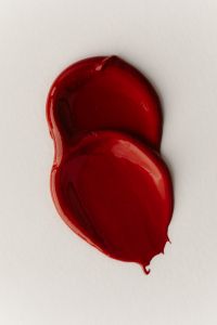 Kaboompics - Two Red Lip Gloss Swatches
