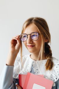 Kaboompics - 12-Year-Old Student with Glasses and Notebook
