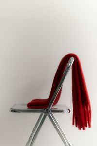 Kaboompics - Minimalist Red Winter Scarf on an Acrylic Chair