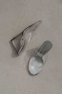 Kaboompics - Clear Heeled Mules Styled on a Pale Stone Floor