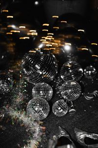 Kaboompics - Silver Disco Balls And Glitter Heels Party Decor