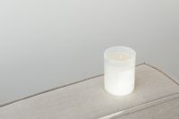 Kaboompics - White Candle Jar Mockup with Blank Label on Linen Sofa