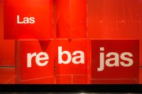 Kaboompics - Red Las Rebajas Lettering on Stacked Display Cubes