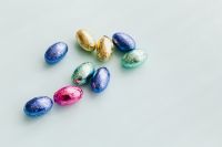Kaboompics - Small Cluster of Foil Easter Eggs with Generous Copy Space
