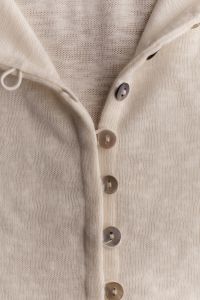 Kaboompics - Beige Knitted Garment With Small Button Details
