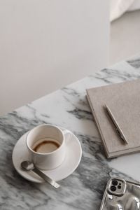 Kaboompics - Coffee, Planner and Silver Phone on Arabescato Marble