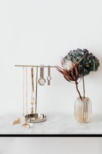 Jewelry and Perfume Product Photography with Watches, Gold Chains and Dried Flowers on Marble