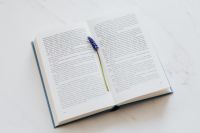 Kaboompics - Open Book with Muscari Bookmark on Marble for Spring Editorial Design
