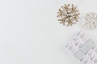 Kaboompics - Glitter Snowflake and Silver Bauble beside a Christmas Gift on Marble