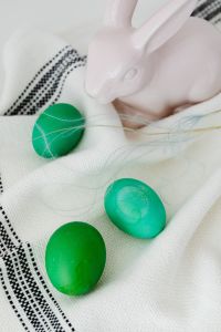 Kaboompics - White Bunny and Green Easter Eggs on Checked Linen