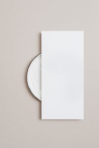 Kaboompics - Vertical Blank Card Mockup with White Plate on Beige Background
