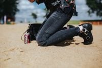 Kaboompics - Young woman wearing a leather jacket and sunglasses on the beach