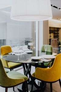 Kaboompics - Modern Interior with Glass Dining Table, Colorful Chairs and Contemporary Furniture