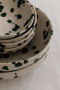 Kaboompics - Close-Up Green Splatter Bowls and Plates with Layered Ceramic Texture