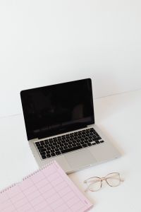 Kaboompics - Open Laptop Beside Pink Calendar and Rose-Tinted Glasses for Work Planning