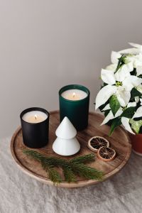Kaboompics - Two Christmas Candles with Poinsettia and Paper Tree