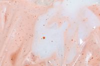 Kaboompics - Blush Skincare Cream Smear with Sparse Exfoliating Granules, Beauty Texture Background